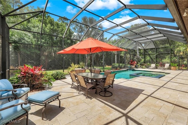 view of swimming pool featuring outdoor dining space, glass enclosure, a pool with connected hot tub, and a patio area