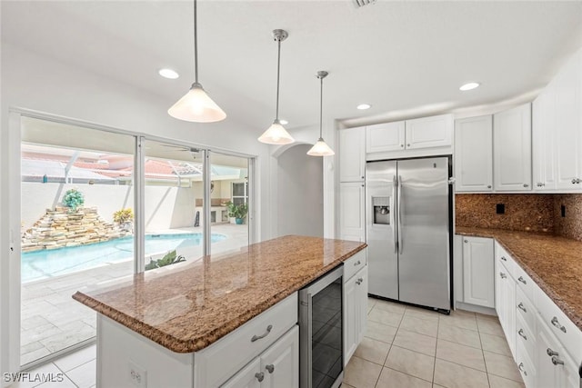 9046 Astonia Way, Estero, FL 33967 - kitchen featuring wine cooler, white cabinetry, stainless steel refrigerator with ice dispenser, a kitchen island, and light tile patterned floors