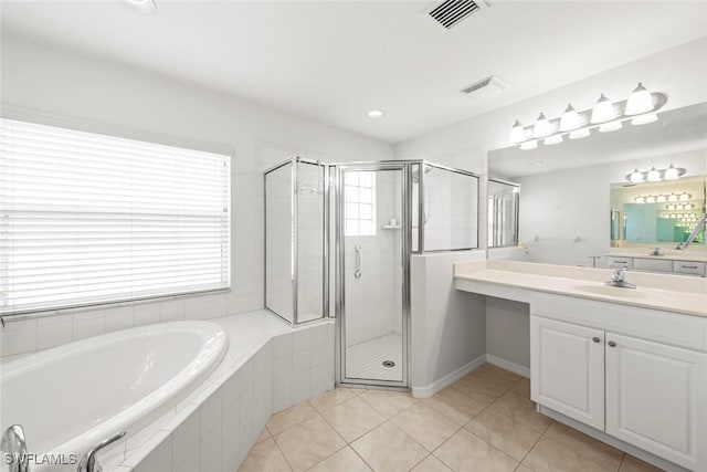 9046 Astonia Way, Estero, FL 33967 - bathroom with a shower stall, tile patterned floors, a bath, vanity, and visible vents