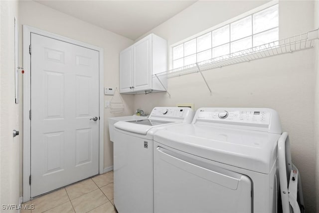9046 Astonia Way, Estero, FL 33967 - laundry room featuring cabinet space, light tile patterned flooring, and independent washer and dryer