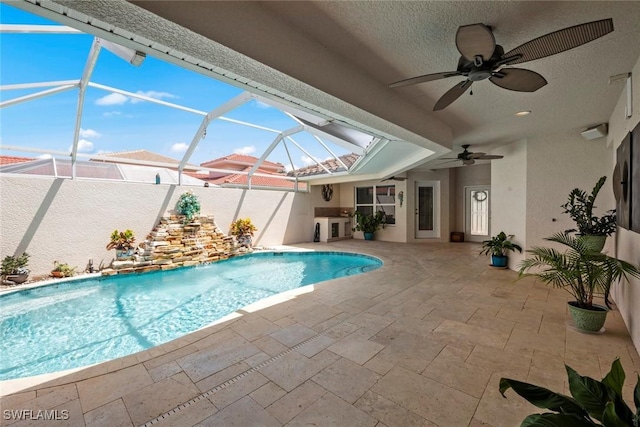 9046 Astonia Way, Estero, FL 33967 - view of pool featuring a patio area, a ceiling fan, a fenced in pool, and glass enclosure