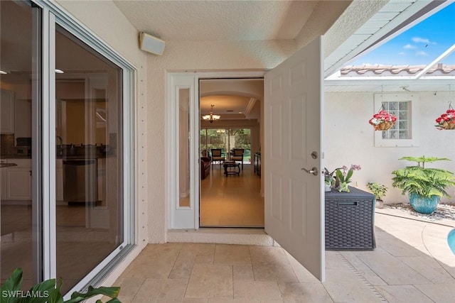 9046 Astonia Way, Estero, FL 33967 - entrance to property featuring stucco siding