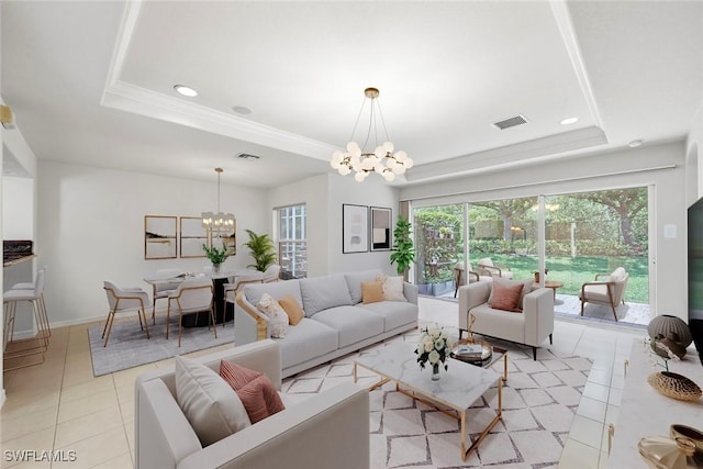 9046 Astonia Way, Estero, FL 33967 - living room featuring visible vents, a tray ceiling, a chandelier, and light tile patterned floors