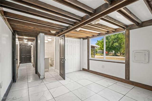 below grade area featuring baseboards