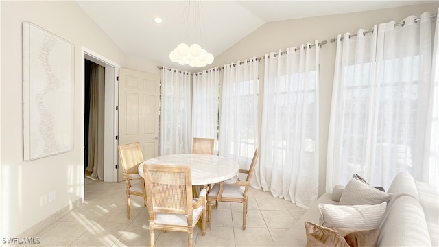 dining space with vaulted ceiling, recessed lighting, and light tile patterned floors