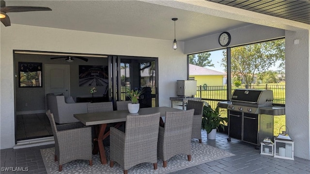 view of patio / terrace with a ceiling fan, outdoor dining area, area for grilling, and fence