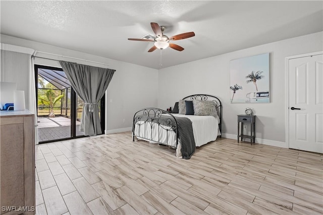 bedroom featuring light wood-style flooring, ceiling fan, baseboards, and access to outside