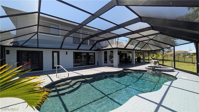view of swimming pool with a lanai, a patio area, a pool with connected hot tub, and french doors