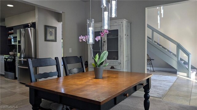 dining room with baseboards, recessed lighting, stairs, and light tile patterned flooring