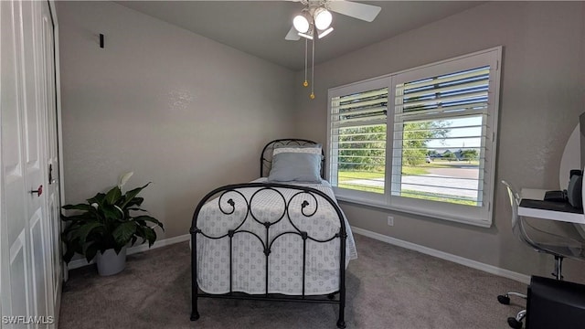 carpeted bedroom with baseboards and ceiling fan