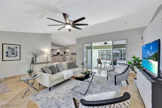 11499 Forest Mere Dr, Bonita Springs, FL 34135 - living room with lofted ceiling, a ceiling fan, visible vents, and baseboards