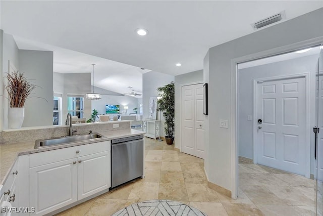 11499 Forest Mere Dr, Bonita Springs, FL 34135 - kitchen featuring white cabinets, stainless steel dishwasher, a sink, vaulted ceiling, and visible vents