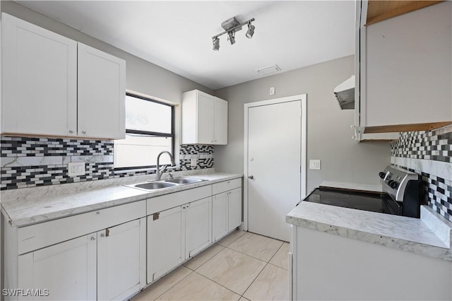 2605 Jackson St, Fort Myers, FL 33901 - kitchen with decorative backsplash, light countertops, visible vents, and a sink