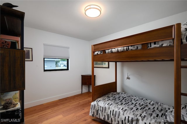 27551 Pullen Ave, Bonita Springs, FL 34135 - bedroom featuring baseboards and light wood-type flooring