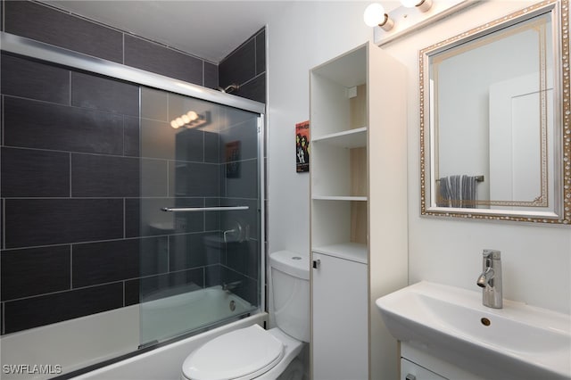 27551 Pullen Ave, Bonita Springs, FL 34135 - bathroom featuring toilet, vanity, and enclosed tub / shower combo