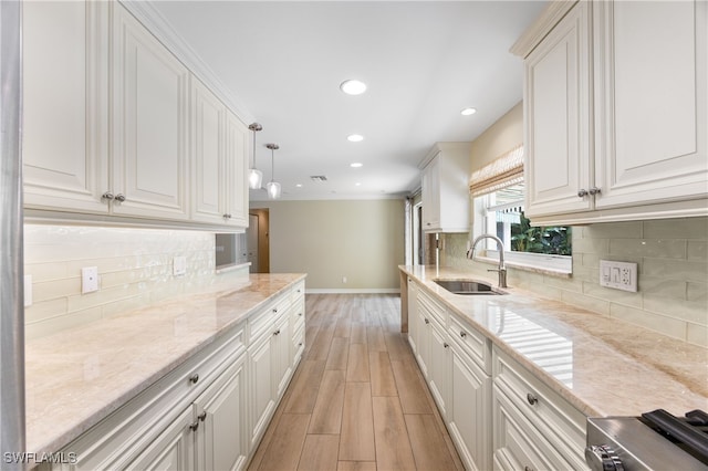 1135 7th St S, Naples, FL 34102 - kitchen featuring light wood-type flooring, decorative backsplash, recessed lighting, and white cabinets