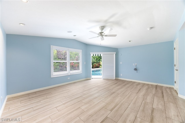1135 7th St S, Naples, FL 34102 - unfurnished room with ceiling fan, lofted ceiling, light wood-style floors, a smoke detector, and recessed lighting