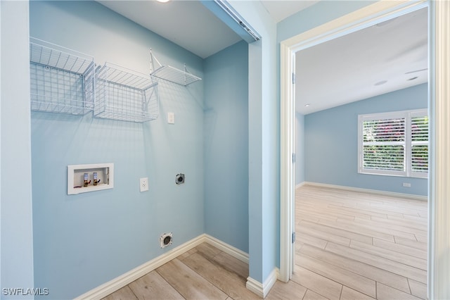 1135 7th St S, Naples, FL 34102 - laundry area featuring electric dryer hookup, wood finished floors, and hookup for a washing machine