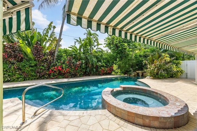 1135 7th St S, Naples, FL 34102 - view of pool with a pool with connected hot tub and a patio area