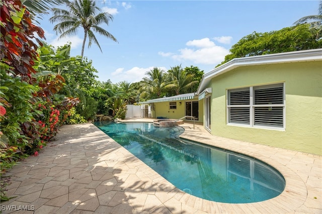 1135 7th St S, Naples, FL 34102 - view of swimming pool with a patio area and a pool with connected hot tub