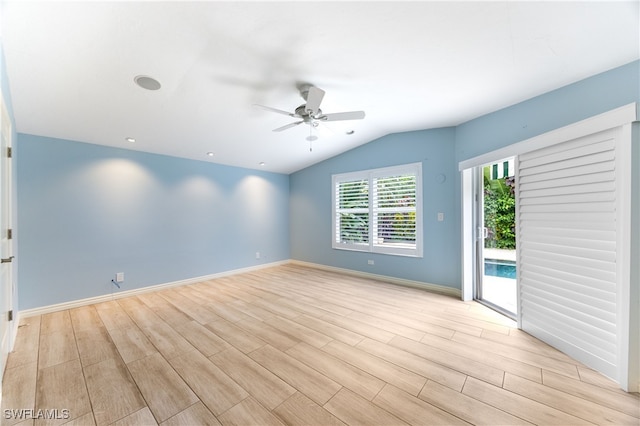 1135 7th St S, Naples, FL 34102 - empty room with light wood-style floors, ceiling fan, and vaulted ceiling