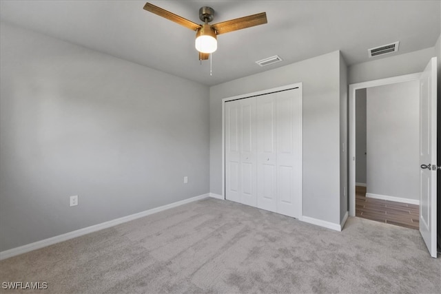 3225 58th St W, Lehigh Acres, FL 33971 - unfurnished bedroom featuring carpet, baseboards, a closet, and visible vents