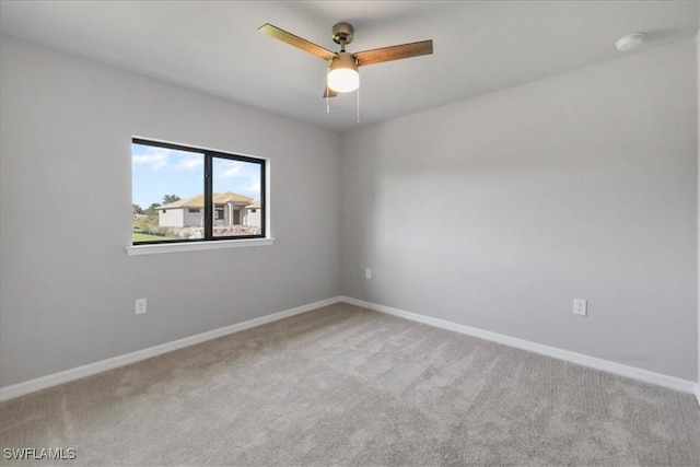 3225 58th St W, Lehigh Acres, FL 33971 - empty room featuring baseboards, ceiling fan, and carpet