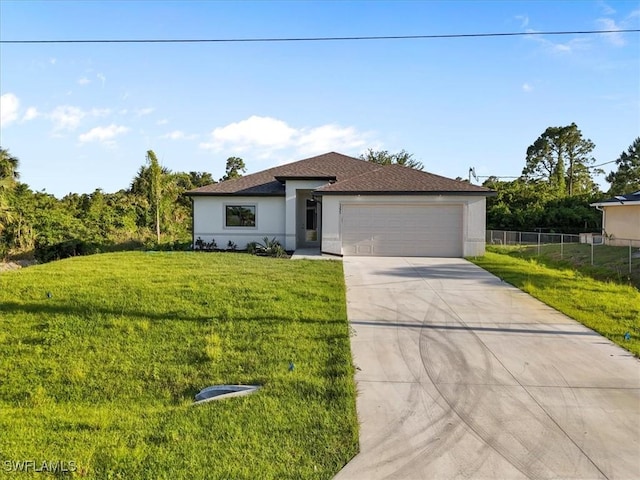3225 58th St W, Lehigh Acres, FL 33971 - view of front of property featuring a garage, stucco siding, fence, concrete driveway, and a front lawn