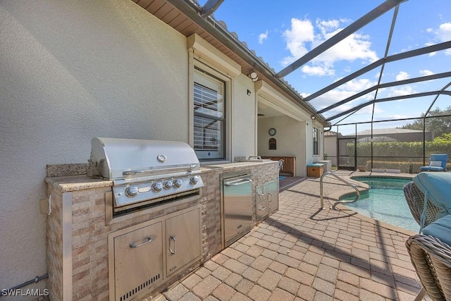 view of patio with area for grilling, exterior kitchen, an outdoor pool, and glass enclosure