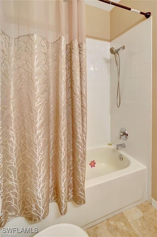 full bath featuring toilet and shower / bathtub combination with curtain