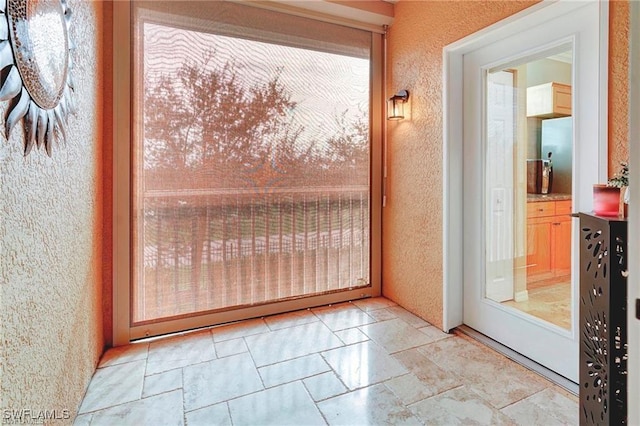 entryway with a textured wall