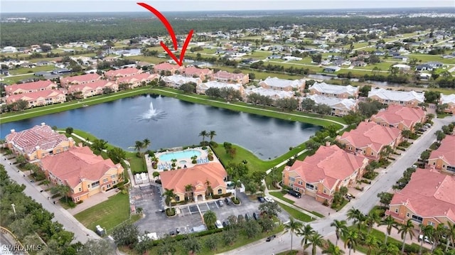 bird's eye view with a water view and a residential view