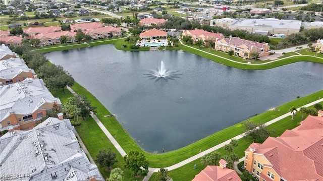 drone / aerial view featuring a water view and a residential view
