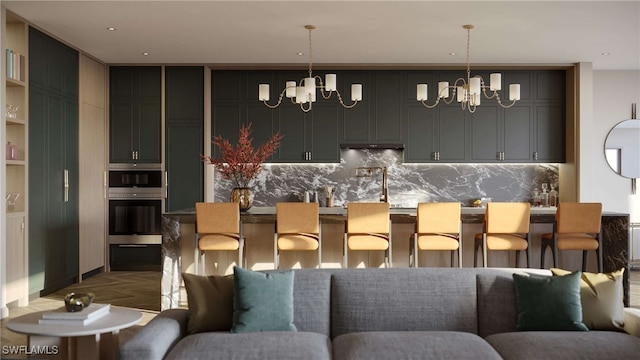 bar with an inviting chandelier, decorative backsplash, and pendant lighting