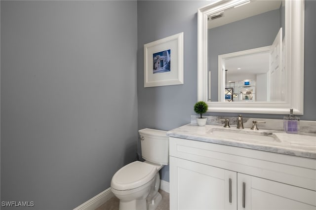 3872 Clipper Cove Dr, Naples, FL 34112 - half bath featuring toilet, vanity, and baseboards