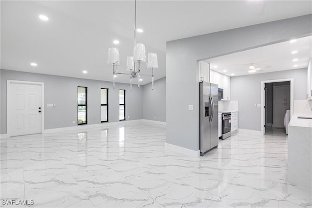 242 Ground Dove Cir, Lehigh Acres, FL 33936 - unfurnished living room with baseboards, recessed lighting, light marble finish floors, and a chandelier
