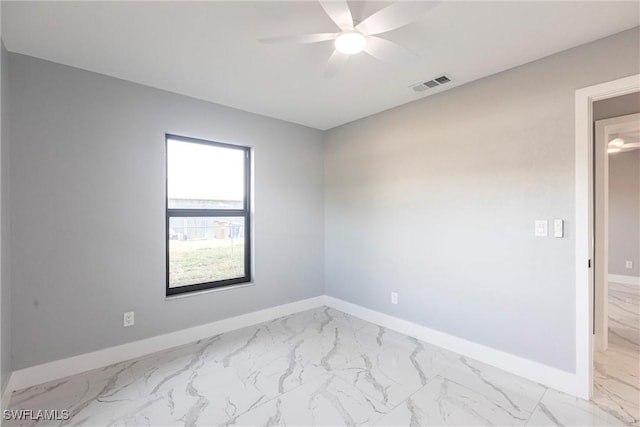 242 Ground Dove Cir, Lehigh Acres, FL 33936 - unfurnished room featuring light marble finish floors, baseboards, and ceiling fan