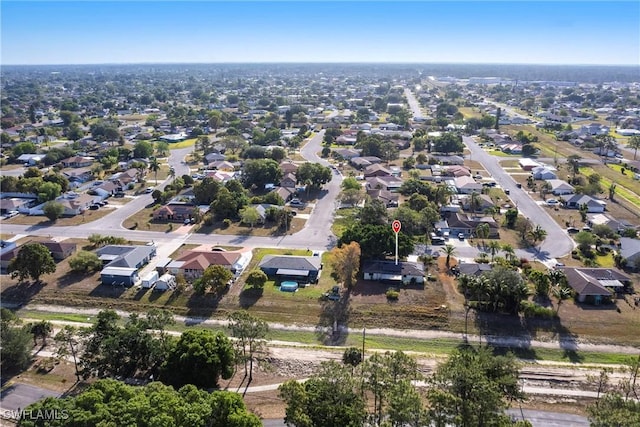 242 Ground Dove Cir, Lehigh Acres, FL 33936 - aerial overview of property's location with nearby suburban area