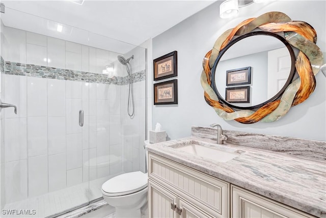 2400 Gulf Shore Blvd N Unit 203, Naples, FL 34103 - bathroom featuring a shower stall, toilet, and vanity