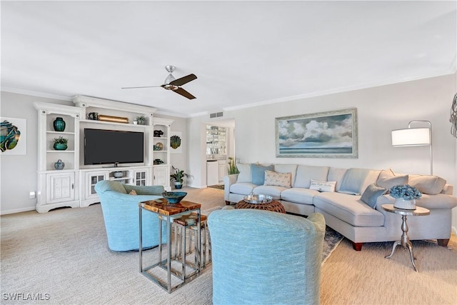 2400 Gulf Shore Blvd N Unit 203, Naples, FL 34103 - carpeted living area with ornamental molding, a ceiling fan, and baseboards