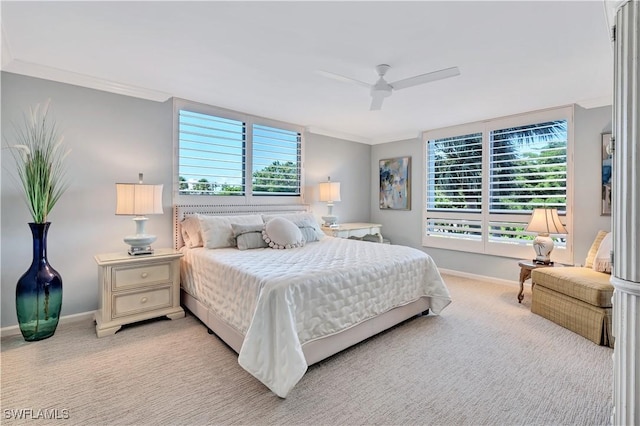 2400 Gulf Shore Blvd N Unit 203, Naples, FL 34103 - bedroom with multiple windows, baseboards, light colored carpet, ornamental molding, and a ceiling fan