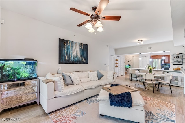20310 Estero Gardens Cir Unit 102, Estero, FL 33928 - living room with light wood-type flooring, visible vents, and ceiling fan