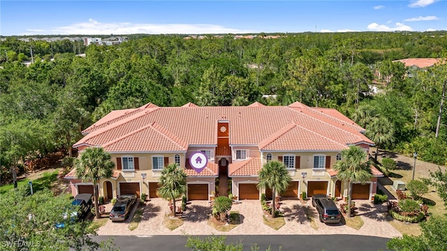 20310 Estero Gardens Cir Unit 102, Estero, FL 33928 - bird's eye view featuring a wooded view