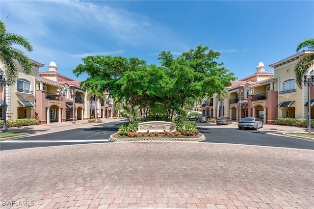 20310 Estero Gardens Cir Unit 102, Estero, FL 33928 - view of street with street lights, curbs, sidewalks, and a residential view