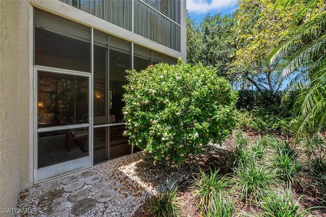 view of side of property with stucco siding