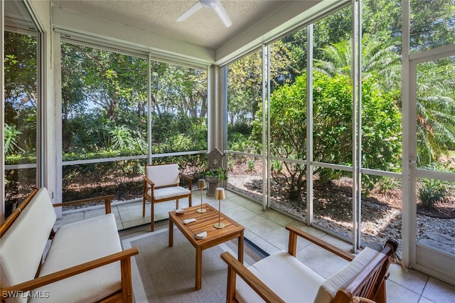 sunroom / solarium with a ceiling fan