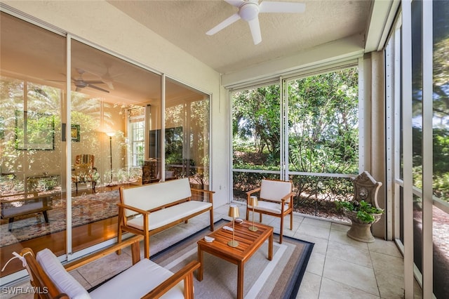 sunroom with ceiling fan and an outdoor hangout area