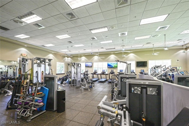 workout area with a paneled ceiling