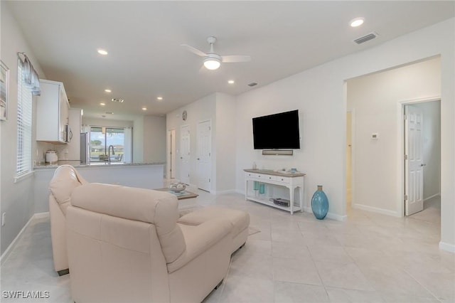 living room featuring visible vents, light tile patterned flooring, baseboards, ceiling fan, and recessed lighting