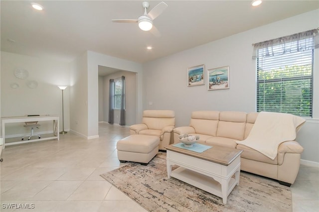 living room with a ceiling fan, baseboards, recessed lighting, and light tile patterned floors